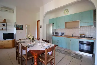 Cucina o angolo cottura di Costa Rei Villa in Prima Fila Mare con Ampio Giardino