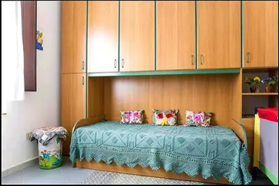 Letto o letti in una camera di Appartamento Vacanza Barisardo SB