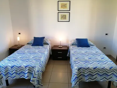 Letto o letti in una camera di Casa il Cortile Fiorito