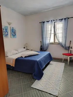 Letto o letti in una camera di Casa Caterina