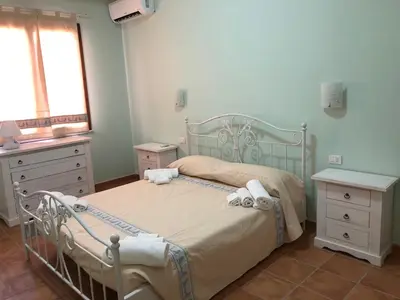 Letto o letti in una camera di Sa Corti Antiga Apartment