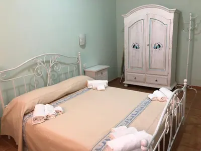 Letto o letti in una camera di Sa Corti Antiga Apartment