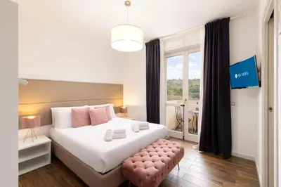 Letto o letti in una camera di Mapi's Rooms - Eja Sardinia