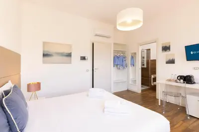 Letto o letti in una camera di Mapi's Rooms - Eja Sardinia