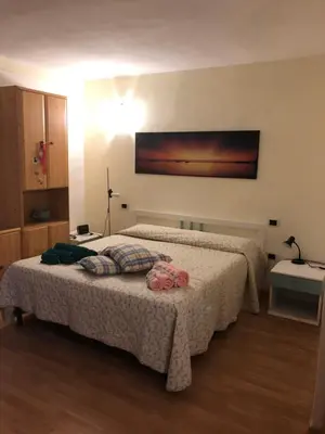 Letto o letti in una camera di DaCapo Rooms