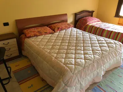 Letto o letti in una camera di B&B City Bar