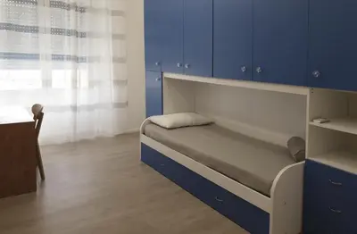 Letto o letti in una camera di Space Apartment