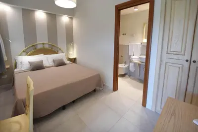 Letto o letti in una camera di B&B I Graniti Sardi