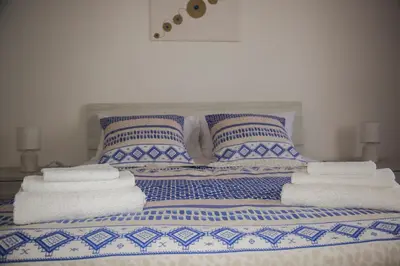 Letto o letti in una camera di casa vacanze Agugliastra