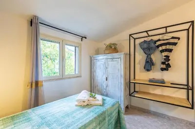Letto o letti in una camera di Casa Cala Luna