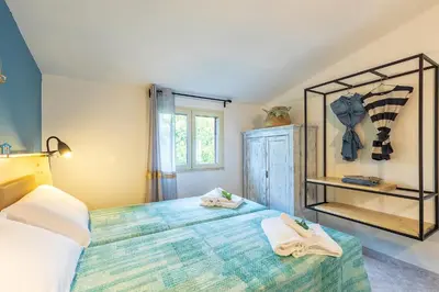 Letto o letti in una camera di Casa Cala Luna