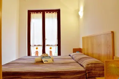 Letto o letti in una camera di Bilo Blu Holiday a 80 metri dal mare