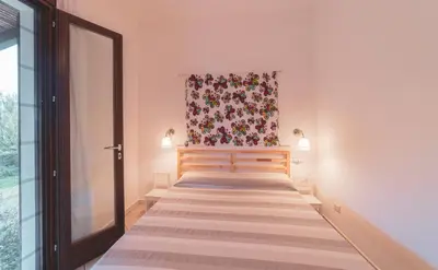 Letto o letti in una camera di Casa Fiore