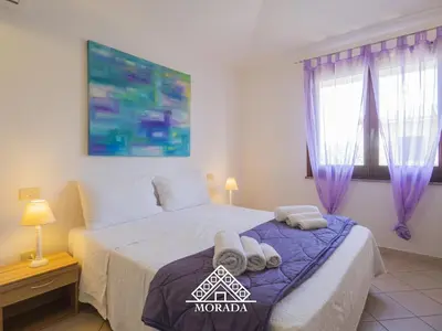 Letto o letti in una camera di Residenza Bougainvillea - MORADA