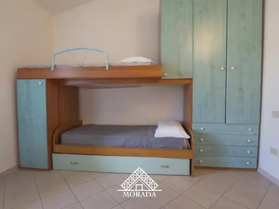 Letto o letti in una camera di Residenza Bougainvillea - MORADA