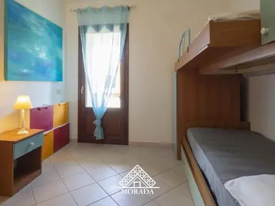 Letto o letti in una camera di Residenza Bougainvillea - MORADA