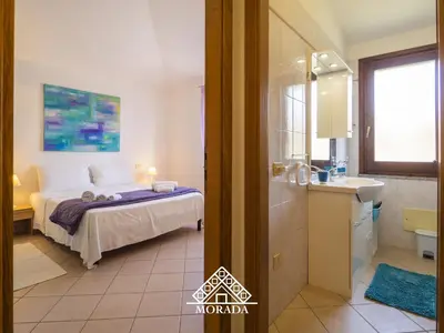 Letto o letti in una camera di Residenza Bougainvillea - MORADA
