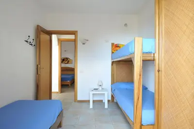 Letto o letti in una camera di Spacious Apartment in Santa Maria Navarrese
