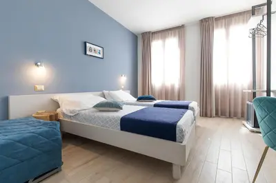 Letto o letti in una camera di La Locanda d'Oro