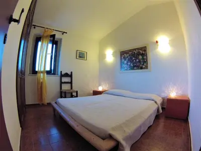 Letto o letti in una camera di Villa Luisa