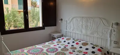 Letto o letti in una camera di Arbatax Apartment