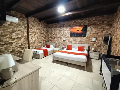 Letto o letti in una camera di Domos La Corte Ghibellina