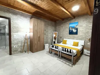 Letto o letti in una camera di Domos La Corte Ghibellina