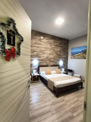 Letto o letti in una camera di Domos La Corte Ghibellina