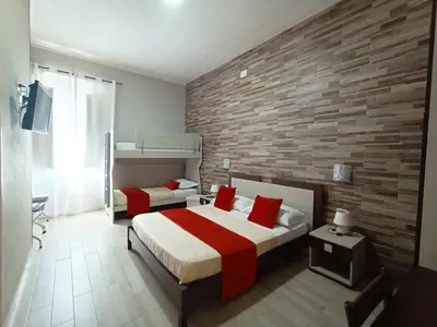 Letto o letti in una camera di Domos La Corte Ghibellina