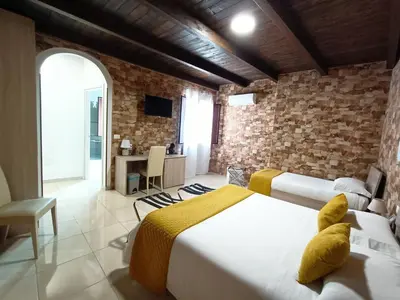 Letto o letti in una camera di Domos La Corte Ghibellina