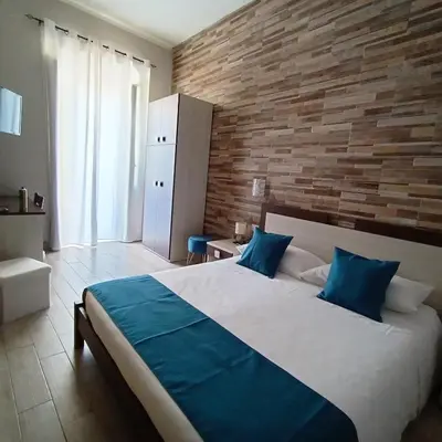 Letto o letti in una camera di Domos La Corte Ghibellina