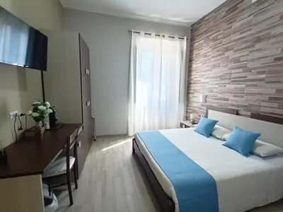 Letto o letti in una camera di Domos La Corte Ghibellina