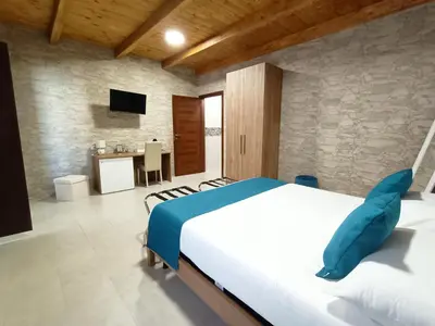 Letto o letti in una camera di Domos La Corte Ghibellina