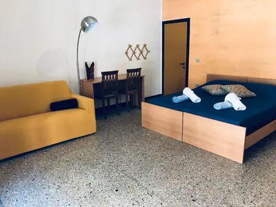 Letto o letti in una camera di CIMAROSA ROOM AFFITTI BREVI