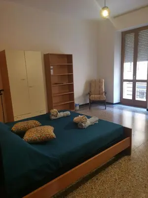 Letto o letti in una camera di CIMAROSA ROOM AFFITTI BREVI