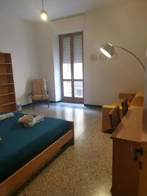 Letto o letti in una camera di CIMAROSA ROOM AFFITTI BREVI