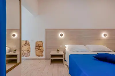 Letto o letti in una camera di Bardilio Luxury Rooms