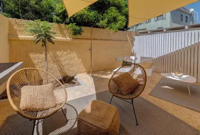 Area soggiorno di Le Palmette Suites