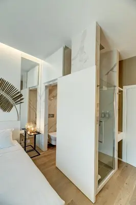 Letto o letti in una camera di Le Palmette Suites