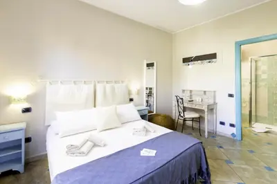 Letto o letti in una camera di Giaco's Rooms