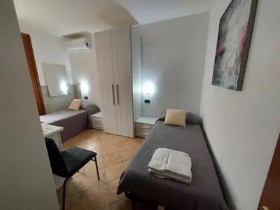 Letto o letti in una camera di B&B Villa Martina