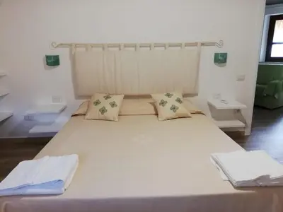 Letto o letti in una camera di Agriturismo Dolceluna Le Capanne
