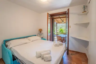 Letto o letti in una camera di Villa Perdalonga, Vista Mare Sea View Tuerredda SouthSardiniaHolidays