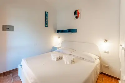 Letto o letti in una camera di Villa Perdalonga, Vista Mare Sea View Tuerredda SouthSardiniaHolidays