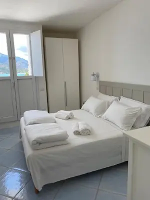 Letto o letti in una camera di SUL MARE SARDEGNA VILLA CLITIA