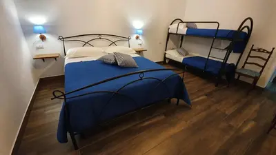 Letto o letti in una camera di DOMU NOSTA di Giulio & Ignazia Room1
