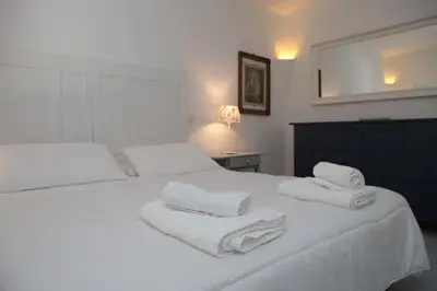 Letto o letti in una camera di SUL MARE SARDEGNA VILLA MERCEDES