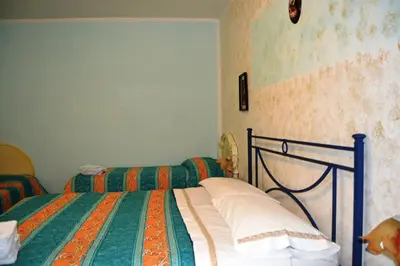 Letto o letti in una camera di Aritzo appartamento bello e comodo
