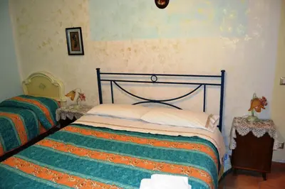 Letto o letti in una camera di Aritzo appartamento bello e comodo