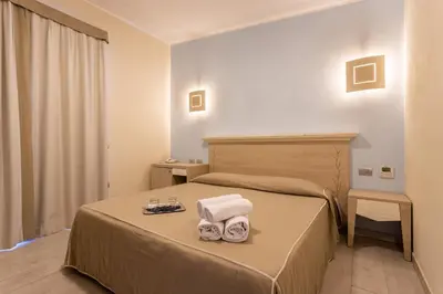 Letto o letti in una camera di Hotel Belvir